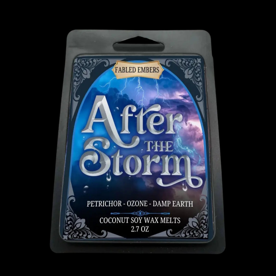 A black container of wax melts, with a label showing a thunderstorm on the front. The label has the title "After the Storm", the brand "Fabled Embers", and scent notes petrichor, ozone, and damp earth. 